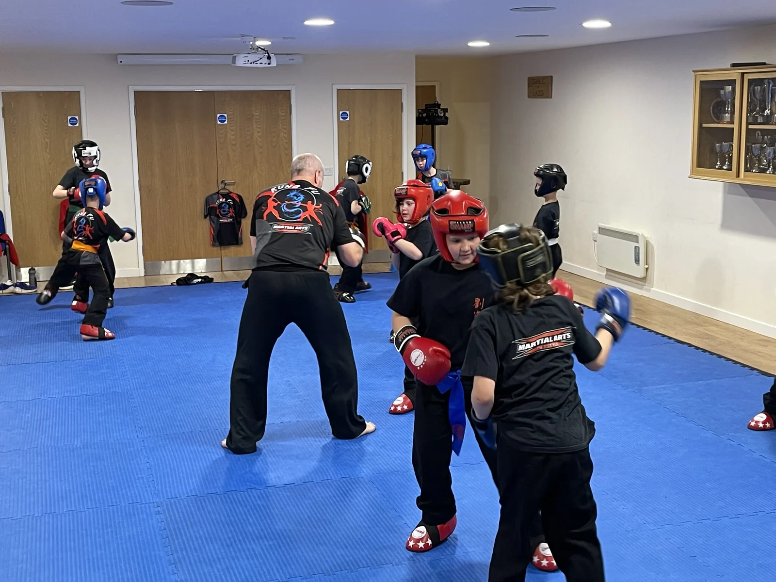 Children training with an instructor at Martial Arts Lifestyle